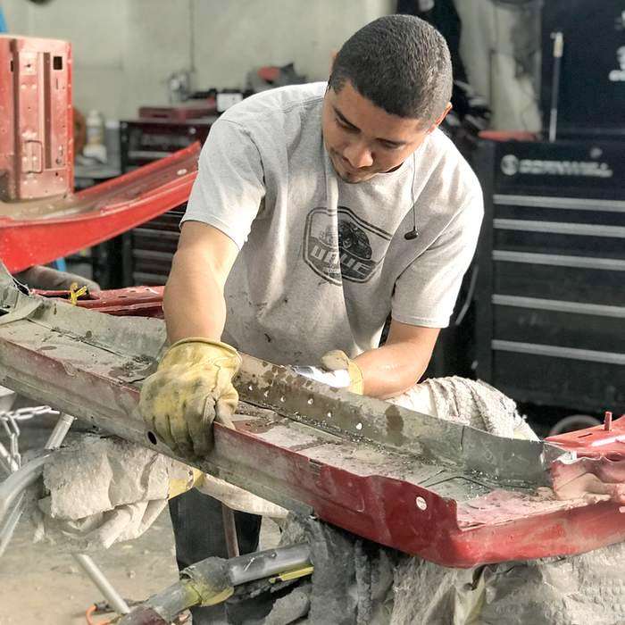 collision repair services tech working